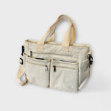 Maria. - Bolsa con varios bolsillos